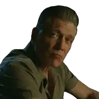 a man with his eyes closed is wearing a grey shirt