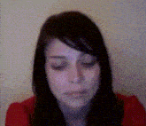 a close up of a woman 's face with a polka dot background