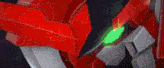 a red robot with horns and a green light on its face is standing in front of a dark background .