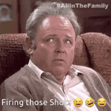 a man is sitting in a chair with the words firing those shots below him