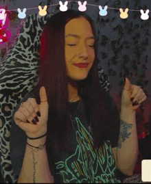 a woman with a tattoo on her wrist that says " i love you "
