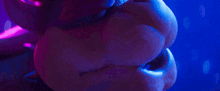 a close up of a person 's face with a purple background .