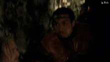 a blurred image of a person in a dark room with the words le dub at the bottom