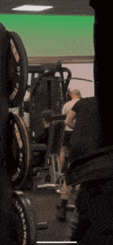 a gym with a lot of dumbbells including one that says gorilla on it
