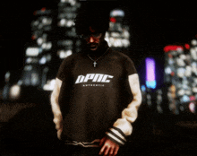 a man wearing a dpnc authentic sweater