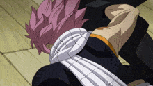 a man with pink hair and a white scarf around his neck