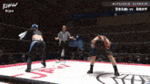 two women are wrestling in a ring with tjpw written on the bottom