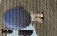 a blurry picture of a person standing in front of a striped wall