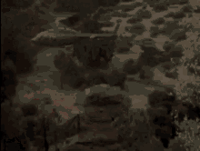 a blurry picture of a man screaming with his mouth open in a dark room .
