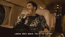a man in a floral jacket says leave bitch leave you are not wanted