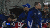 a man wearing a blue hat that says rcz on it