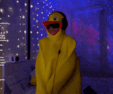 a person in a yellow duck costume with headphones on
