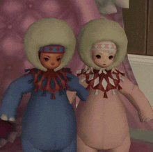 two clown dolls are standing next to each other with their heads on their shoulders
