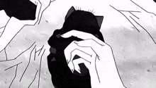 a black and white drawing of a person holding a cat .
