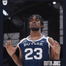 a man wearing a blue butler jersey number 23