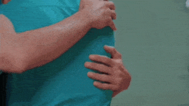 a man and a woman are hugging each other in a hospital .