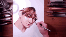 a drawing of a man 's face is being drawn with a pencil that says prismacolor