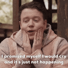 a man with his hands on his face and the words i promised myself i would cry and it 's just not happening below him