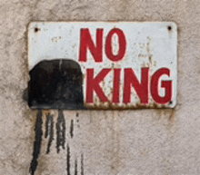 a sign on a wall that says " no parking "