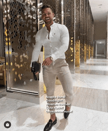 a man wearing a white shirt and khaki pants stands in a hallway with the words noapte buna goodnight
