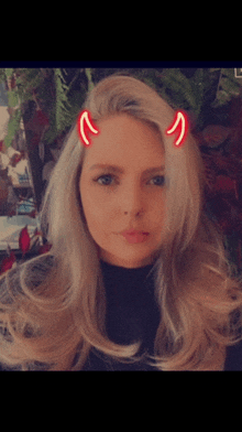 a woman with devil horns on her hair