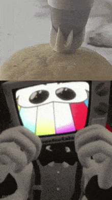 a cartoon character in a tuxedo is holding a tv with a rainbow face on it