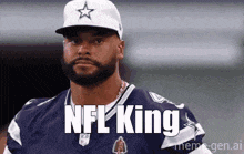 a man with a beard is wearing a cowboys jersey and a hat with the word nfl king written on it