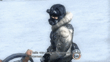 a man in a gas mask holds a gun