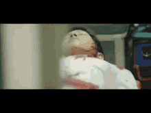 a close up of a person laying on a bed