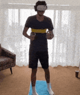 a man wearing a virtual reality headset is holding two remotes