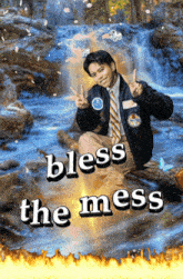 a poster with a man giving a peace sign and the words bless the mess below him