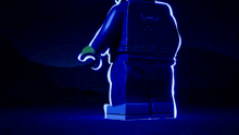 a lego figure is glowing in the dark and has a g on her belt
