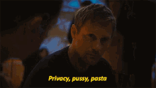 a man drinking from a bottle with the words privacy pussy pasta in yellow