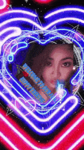 a picture of a woman in a neon heart with the words happy new year written on it