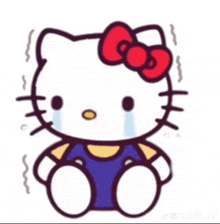 a crying hello kitty with a red bow