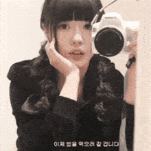 a girl is taking a picture of herself with a camera