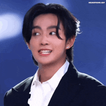 a close up of a person 's face with the words heartchu.gif written on the bottom