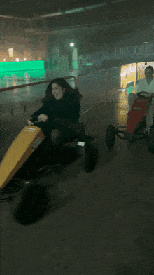 a person is riding a go kart in a parking garage with the word shagarita on the bottom