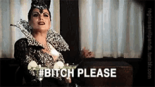 a woman in a black and white dress is holding a martini and saying bitch please .