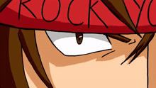 a close up of a person 's face with a red bandana that says rocky