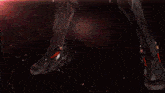 a blurred image of a person 's face with a red and orange background