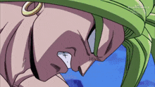 a close up of a cartoon character with green hair and a gold ring on his ear