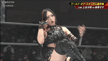 a woman in a wrestling ring with the word stardom on the bottom left