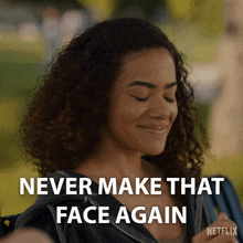 a woman is smiling with the words never make that face again