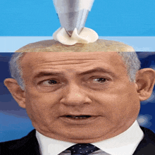 a close up of a man 's face with a whipped cream cone on top of it