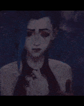 a man and a woman are hugging each other . the woman has blue hair .