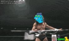 a wrestler with a blue monster on his head holds a flag in a wrestling ring
