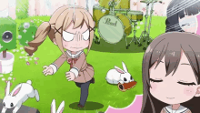a girl is standing in front of a drum set with the word pearl on it
