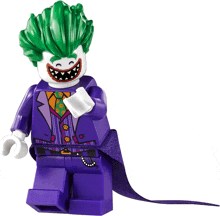 a lego figure of the joker with green hair and a purple cape