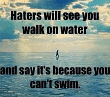 a man is walking on a paddle board in the ocean with a quote .